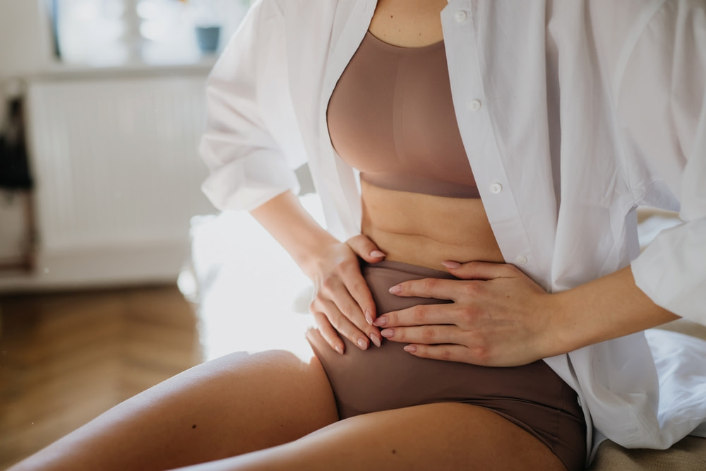 A woman suffering from adenomyosis symptoms