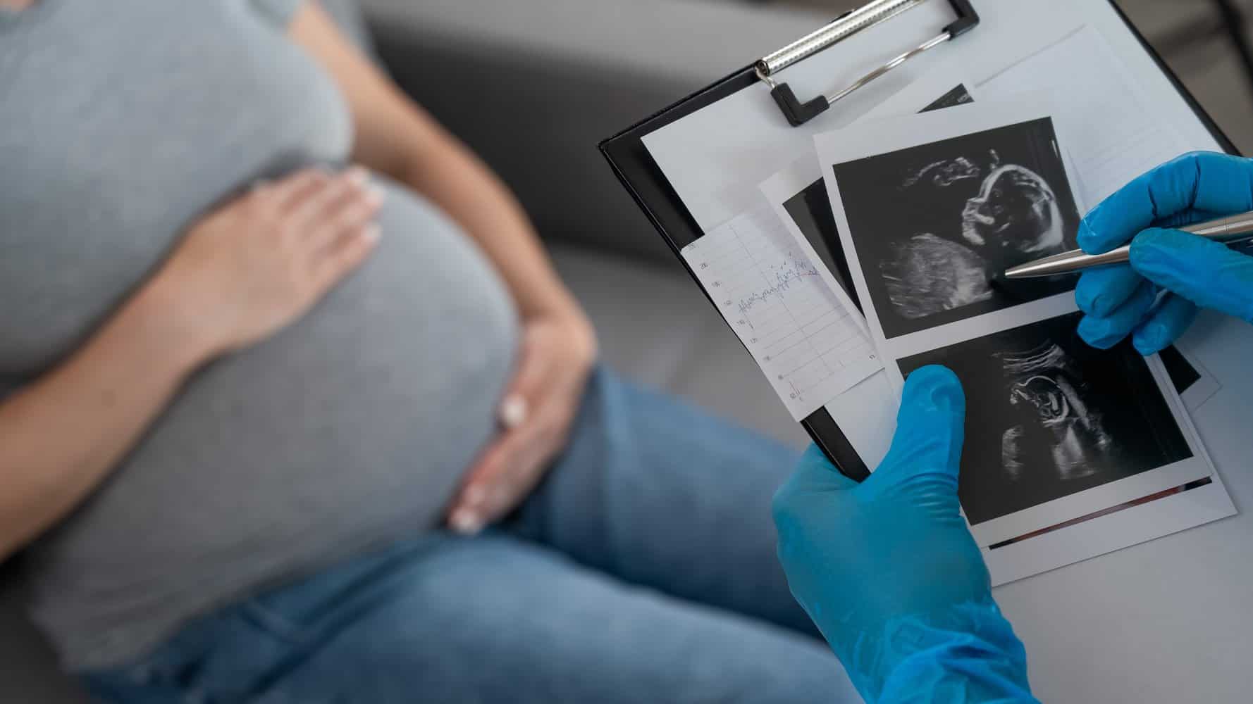 A doctor discussing an ultrasound result during a check-up