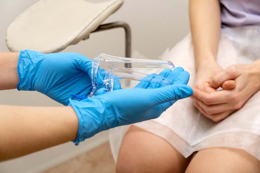 A woman preparing for a pelvic exam due to concerns about a cervical polyp